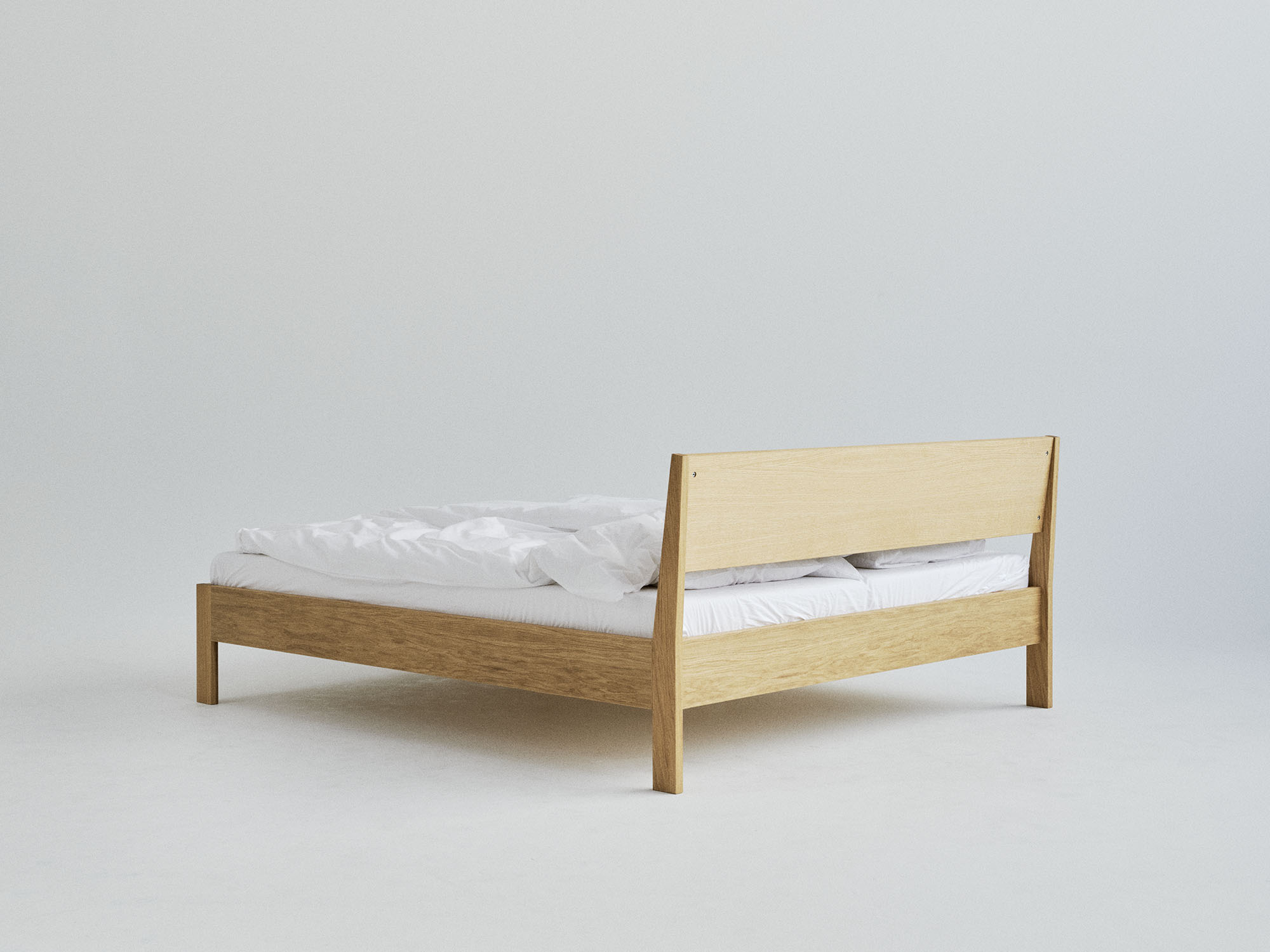 Ejer Bed Frame seng i eik sett fra baksiden